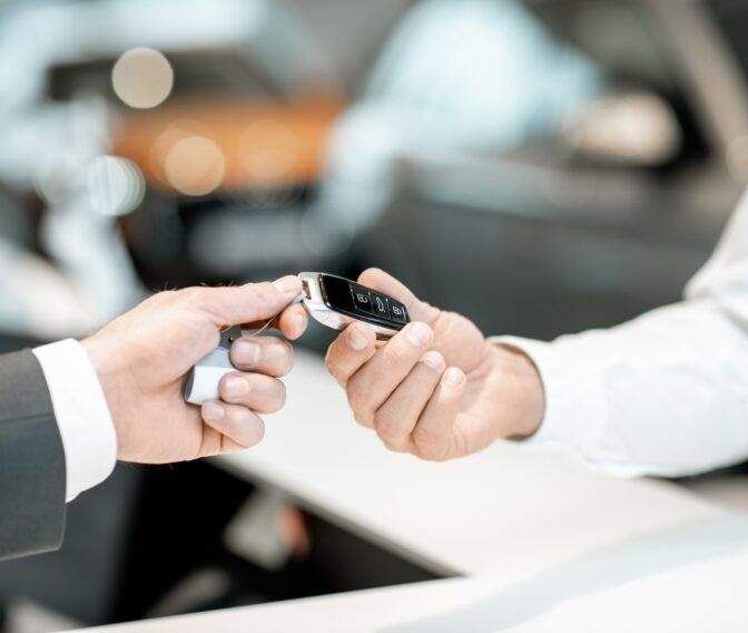 Giving car keys in the showroom